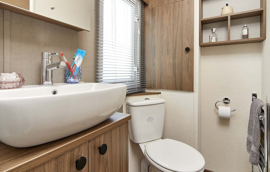bathroom with window of The Carrington caravan